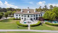 606 Wild Dunes Circle, Wilmington, NC 28411 — 3-bedroom waterfront home in Porters Neck Plantation, Wilmington, NC, photo 8 of 15: backofclub