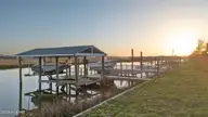 103 E Island Drive, Oak Island, NC 28465 — 3-bedroom waterfront home, Oak Island, NC, photo 5 of 76: 83_twilight
