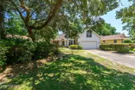 514 Woods Court SW, Sunset Beach, NC 28468 — 3-bedroom home in Sea Trail Plantation, Sunset Beach, NC, photo 2 of 50: 21-web-or-mls-14 front