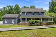 305 Grovediere Lane, Hampstead, NC 28443 — 4-bedroom waterfront home in Forest Sound, Hampstead, NC, photo 1 of 75