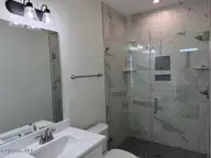 124 Shell Road, Surf City, NC 28445 — 3-bedroom waterfront townhome in Dune Ridge, Surf City, NC, photo 20 of 33: 126 Shell Primary Shower