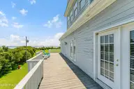 255 Oak Road, Beaufort, NC 28516 — 3-bedroom waterfront home, Beaufort, NC, photo 10 of 45: Deck off of living room