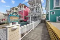 233 Sea Dreams Drive, Atlantic Beach, NC 28512 — 3-bedroom home in Sea Dreams, Atlantic Beach, NC, photo 8 of 68: walkway to pool