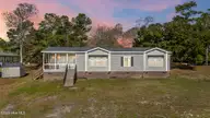 120 Moores Landing Road, Hampstead, NC 28443 — 3-bedroom manufactured home in Moores Landing, Hampstead, NC, photo 1 of 51: 1_virtual twilight