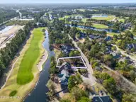 8815 10 Carenden Court, Sunset Beach, NC 28468 — waterfront lot in Thistle Downs, Sunset Beach, NC, photo 1 of 22: DJI_0035 copy