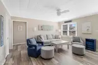 902 Ocean Drive E&W, Emerald Isle, NC 28594 — 4-bedroom home in Emerald Isle By The Sea, Emerald Isle, NC, photo 6 of 45: Living Room - East Side