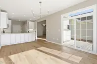 114 Jordan Drive, New Bern, NC 28562 — 4-bedroom waterfront townhome in Wesmill Pond Estates, New Bern, NC, photo 11 of 37: Dining Area to Deck