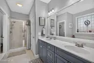 2037 Fanning Court, Leland, NC 28451 — 4-bedroom home in Waterford of the Carolinas, Leland, NC, photo 21 of 64: Primary Bathroom