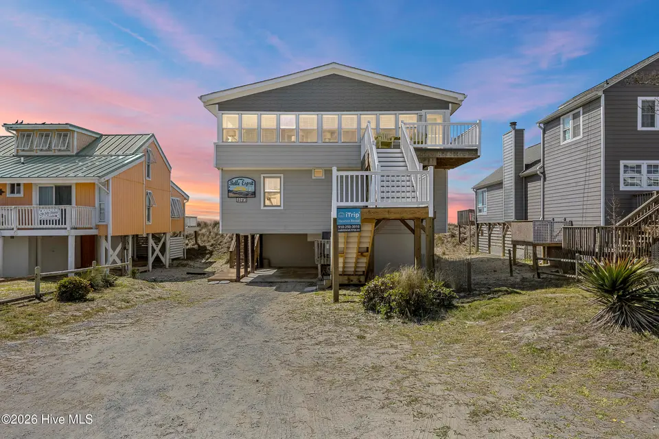 5127 W Beach Drive, Oak Island, NC 28465 — 5-bedroom waterfront home, Oak Island, NC, photo 1 of 73: 1_virtual twilight