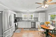 166 NE 5th Street, Oak Island, NC 28465 — 3-bedroom home in Tranquil Harbor, Oak Island, NC, photo 15 of 59: 13_kitchen & dining area