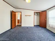 107 Bluebird Drive, Elizabeth City, NC 27909 — 3-bedroom manufactured home in Halls Creek Village, Elizabeth City, NC, photo 17 of 21: Bedroom 3