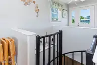 6301 Ocean Drive, Emerald Isle, NC 28594 — 6-bedroom waterfront home, Emerald Isle, NC, photo 21 of 43: spiral staircase