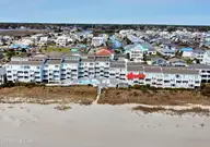 16 E First Street # 109, Ocean Isle Beach, NC 28469 — 1-bedroom waterfront condo in Ocean Cove, Ocean Isle Beach, NC, photo 2 of 24: Drone655