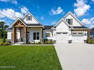 914 Maggie Lane, Elizabeth City, NC 27909 — 4-bedroom waterfront home in Newbegun Land, Elizabeth City, NC, photo 2 of 4: Modern Farmhouse Exterior with Lush Land