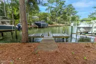 117 White Ash Drive, Pine Knoll Shores, NC 28512 — waterfront lot in Pine Knoll Association, Pine Knoll Shores, NC, photo 24 of 40: Dock at end of canal