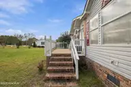 7133 Roebuck Lane NE, Leland, NC 28451 — 3-bedroom manufactured home in Hunters Ridge, Leland, NC, photo 6 of 44: 6_img_0868