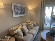 812 Shepard Street 331, Morehead City, NC 28557 — 1-bedroom waterfront condo in Bask II Condos, Morehead City, NC, photo 3 of 14: Living room