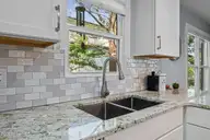 904 Coral Court, New Bern, NC 28560 — 4-bedroom waterfront home in Fairfield Harbour, New Bern, NC, photo 13 of 64: tile backsplash