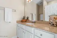 7650 Front Street Unit 3, Sunset Beach, NC 28468 — 2-bedroom townhome in Seaside Village, Sunset Beach, NC, photo 24 of 37: Guest Sink Vanity