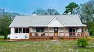 501 Shoreline Drive E, Sunset Beach, NC 28468 — 3-bedroom waterfront home in Shoreline Woods, Sunset Beach, NC, photo 1 of 39: coverupdated
