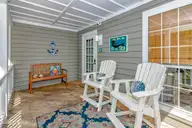 23 Ibis Roost, Bald Head Island, NC 28461 — 3-bedroom home in Ibis Roost, Bald Head Island, NC, photo 4 of 40: Covered Porch