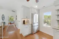 106 Wyndward Court, Emerald Isle, NC 28594 — 4-bedroom home in Wyndtree, Emerald Isle, NC, photo 11 of 63: Kitchen with granite countertops