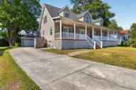 106 Portside Lane, New Bern, NC 28562 — 4-bedroom home in River Bend, New Bern, NC, photo 8 of 65: Side view with dettached garage