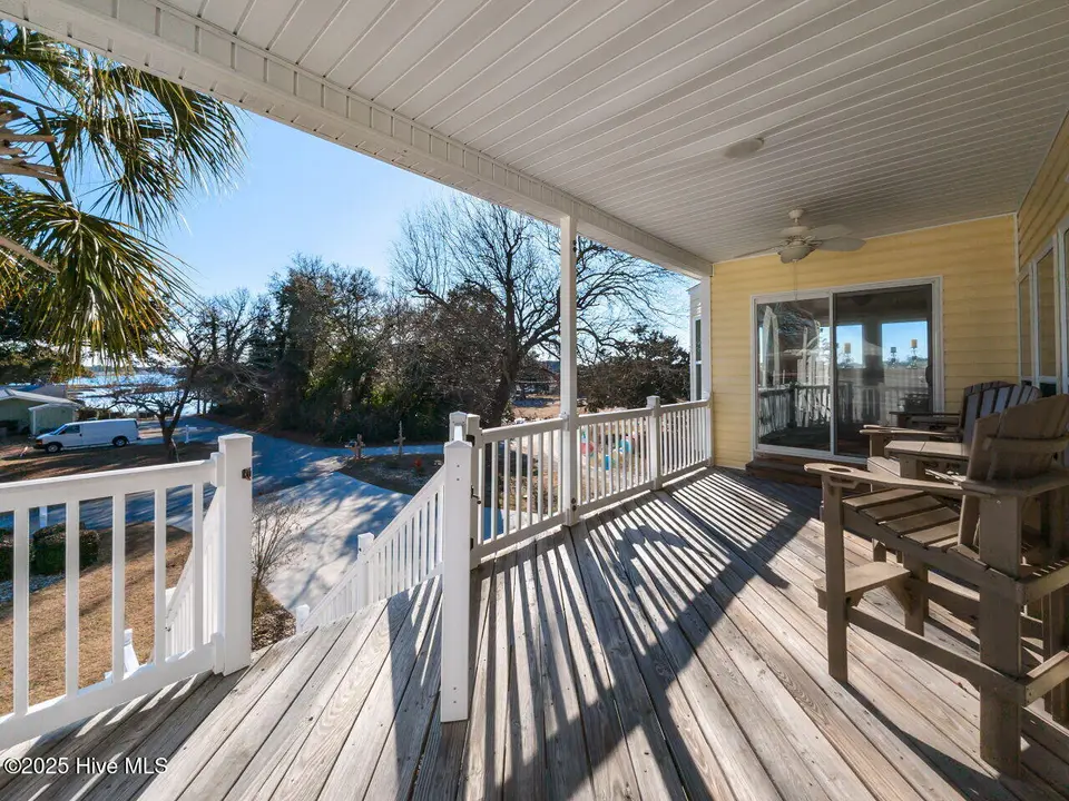 129 Sunset Drive, Cedar Point, NC 28584 — 3-bedroom waterfront home in Plantation Shores, Cedar Point, NC, photo 1 of 46: 003-1280x960-covered-front-porch