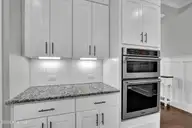 135 Spicer Lake Drive, Holly Ridge, NC 28445 — 4-bedroom waterfront home in Summerhouse On Everett Bay, Holly Ridge, NC, photo 13 of 75: Kitchen