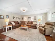 419 Riverside Lane, Stella, NC 28582 — 4-bedroom waterfront home in Riverside Plant, Stella, NC, photo 11 of 36: living room