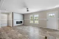 6830 Lewis Drive SE, Winnabow, NC 28479 — 3-bedroom manufactured home in Lewis Acres, Winnabow, NC, photo 8 of 29: Living room