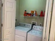 100 Lighthouse Lane C1, Cedar Point, NC 28584 — 2-bedroom condo in Village at Magens Bay, Cedar Point, NC, photo 16 of 19: Laundry