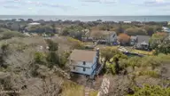 125 Loblolly Drive, Pine Knoll Shores, NC 28512 — 5-bedroom waterfront home in Pine Knoll Association, Pine Knoll Shores, NC, photo 5 of 68: Aerial