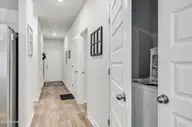 2049 Wild Indigo Circle NW, Calabash, NC 28467 — 3-bedroom townhome in Brunswick Plantation, Calabash, NC, photo 6 of 40: Main Hallway Entry
