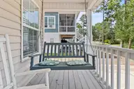 316 NE 52nd Street, Oak Island, NC 28465 — 3-bedroom home in Tranquil Harbor, Oak Island, NC, photo 15 of 49: 10_front porch