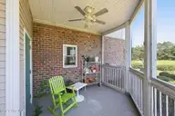 402 Penny Lane D, Morehead City, NC 28557 — 3-bedroom condo in Madisen Park, Morehead City, NC, photo 16 of 46: Covered, Screened-In Back Patio