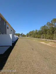 97 Commons View Drive, Hampstead, NC 28443 — 3-bedroom townhome in Southwater Village, Hampstead, NC, photo 3 of 13: TH back