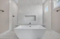 108 Whispering Pine Lane, Holly Ridge, NC 28445 — 4-bedroom waterfront home in Summerhouse On Everett Bay, Holly Ridge, NC, photo 23 of 52: primary ensuite