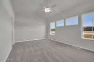 475 Galloping Foal Way SE, Bolivia, NC 28422 — 3-bedroom home in River Tide Farms, Bolivia, NC, photo 17 of 31: Primary Bedroom Windows