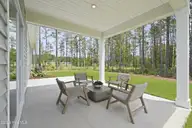 2025 Brisco Way 7, Leland, NC 28451 — 3-bedroom home in Brunswick Forest, Leland, NC, photo 13 of 23: Covered Patio
