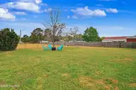 3107 Harvest Road, Castle Hayne, NC 28429 — 3-bedroom home in Apple Valley, Castle Hayne, NC, photo 17 of 20: Harvest bk yard
