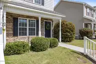 27 E Doris Avenue 111, Jacksonville, NC 28540 — 2-bedroom townhome in Doris Place, Jacksonville, NC, photo 5 of 29: 6_back exterior
