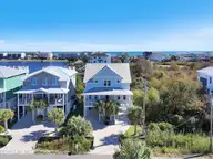 611 Third Street S, Carolina Beach, NC 28428 — 4-bedroom waterfront home, Carolina Beach, NC, photo 1 of 73: 77-Final Drone 611 S 3rd St-RJREM-
