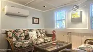 2495 Barracuda Street SW, Supply, NC 28462 — 2-bedroom manufactured home in Sandy Shoals, Supply, NC, photo 9 of 54: Mini Split AC & Heat on Porch