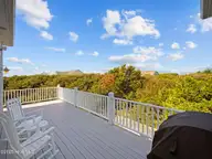 6414 Ocean Drive, Emerald Isle, NC 28594 — 5-bedroom waterfront home in Sea Crest, Emerald Isle, NC, photo 18 of 56: Deck off kitchen overlooking pool