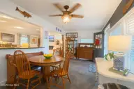 7908 E Yacht Drive, Oak Island, NC 28465 — 2-bedroom waterfront home in Tranquil Harbor, Oak Island, NC, photo 12 of 25: dining