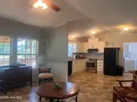 204 Diamond City Drive, Harkers Island, NC 28531 — 2-bedroom manufactured home in Earl Davis, Harkers Island, NC, photo 2 of 13: Kitchen Living room