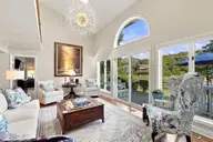 152 Arborvitae Drive, Pine Knoll Shores, NC 28512 — 3-bedroom waterfront home in Pine Knoll Association, Pine Knoll Shores, NC, photo 9 of 61: Living Room