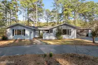 10 Fairway Drive, Whispering Pines, NC 28327 — 3-bedroom home in Whispering Pines, Whispering Pines, NC, photo 1 of 50: Front of House