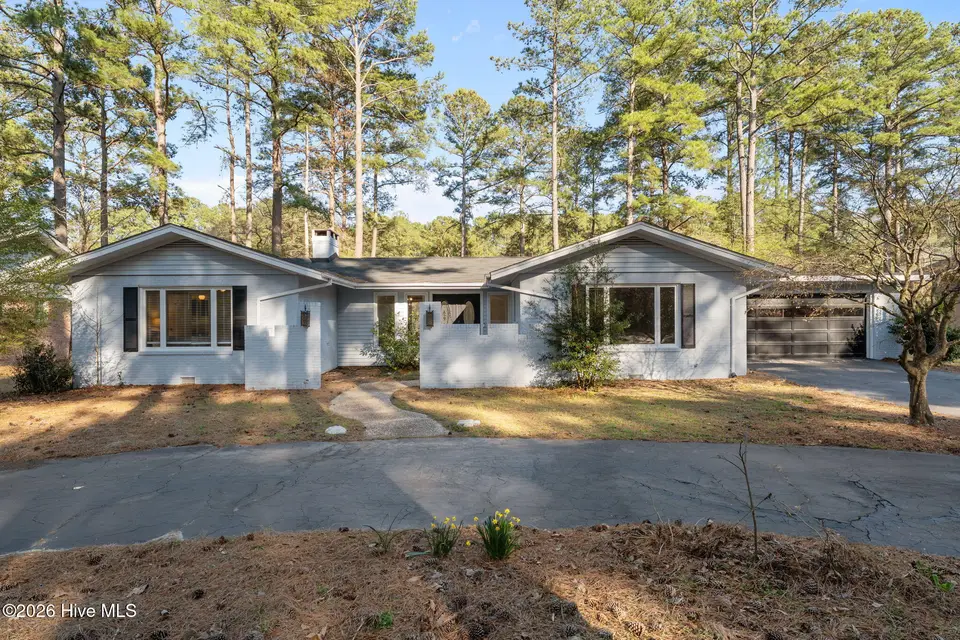 10 Fairway Drive, Whispering Pines, NC 28327 — 3-bedroom home in Whispering Pines, Whispering Pines, NC, photo 1 of 50: Front of House